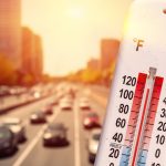 Thermometer,In,Front,Of,Cars,And,Traffic,During,Heatwave